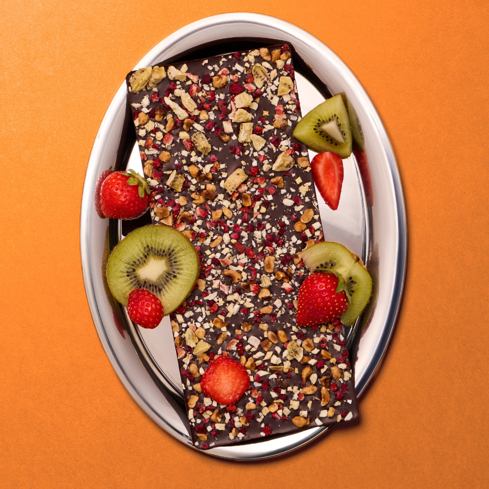 DARK CHOCOLATE TUTTI FRUTTI BARK WITH STRAWBERRY, KIWI, PINEAPPLE, MANGO AND HAZELNUTS
