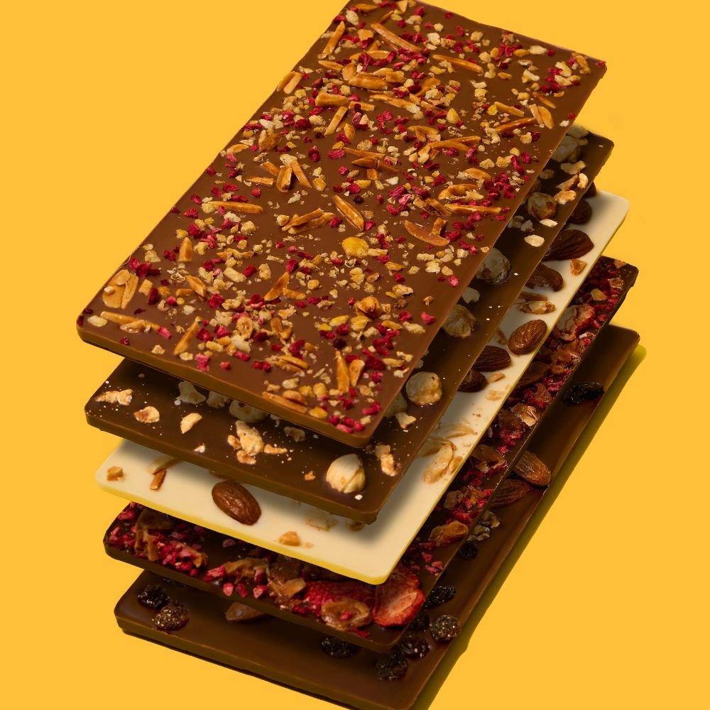 MILK CHOCOLATE BARK, ALMONDS, CORN NUGGETS AND RASPBERRIES